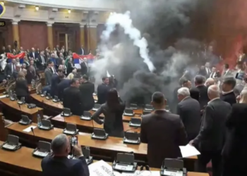 Serbian opposition lawmakers disrupt parliament with smoke bombs and flares