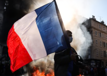 France considers partial curfews after weekend of riots and looting